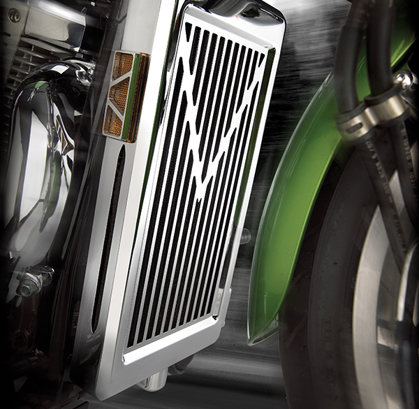 Large image of a chrome radiator grille cover on a green Honda Shadow